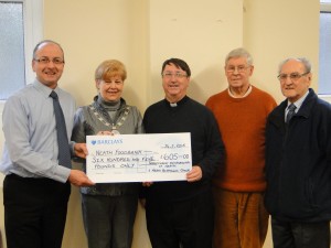 Pictured from left to right:  Mark Ritzmann and Anne Ellis, with representatives of Neath Foodbank, Canon Stephen Ryan, Roy Callard and Jack Crowther    